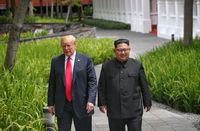 L&K Liberace and Kim Jong Un walking in the park.